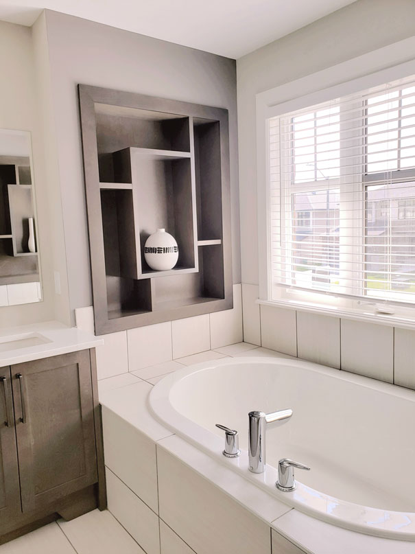 a white bathtub in a bathroom