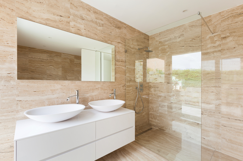 a bathroom with a shower and two sinks